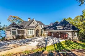 It maximizes a sloping lot, adds square footage without increasing the footprint of the home, and creates another level of outdoor living. Walkout House Designs