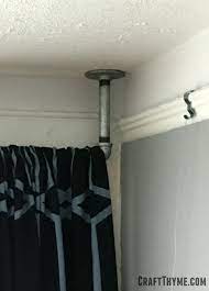 Galvanized plumbing curtain rod, hung from ceiling to make ceilings appear taller. How To Make Galvanized Pipe Curtain Rods The Reaganskopp Homestead