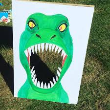 Dinosaur Party Feed The Dino Game We Got The Children To Throw Fake Food Into The Mouth We Had A Sou Dinosaur Party Games Dinosaur Party Food Dinosaur Party