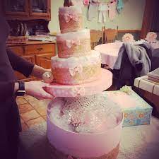 Pink And Gold Otter Diaper Cake On Top Of A Hatbox Full Of Gifts By Bstarz Cake Diaper Cake Baby Shower Gifts