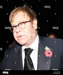 Elton john with a poppy hi-res stock photography and images