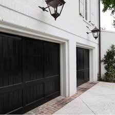 Black And White House With Wood Garage Door Black Garage Doors Monochrome Traditional Garage Door Design Exterior House Colors Shutters Exterior