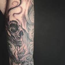 Skull In The Smoke Tattoo As A Filler For A Time Sleeve Black And Grey Tattoo Sleeve Filler Tattoo Filler Tattoos