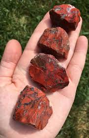 The mottled black and red eudialyte stone has been polished and sculpted into the shape of a giant, humanoid heart. Red Jasper Stone Jasper Stone Jasper