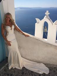 Blush wedding dress with a white lace bodice and an illusion neckline and the groom in black. Blue Black White And Gold Wedding Dresses