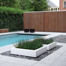 Modern Pool Fun Accent Planters White With Dark Cobbles Pool Landscaping Modern Garden Design Modern Landscaping