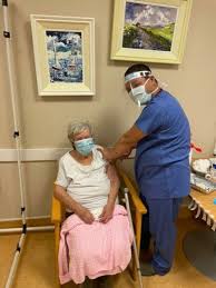 p11 Lillian Carroll receiving covid vaccine