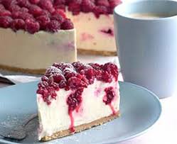 White chocolate cheesecake with caramel and macadamia nuts tastes as rich and glorious as it sounds. White Chocolate And Raspberry Cheesecake Everyday Delicious K Chocolate Raspberry Cheesecake Raspberry Cheesecake Recipe White Chocolate Raspberry Cheesecake