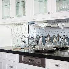 Glam Wet Bar With Arched Antiqued Mirrored Backsplash Cottage Kitchen Kitchen Mirror Bar Cabinet Design Glass Kitchen