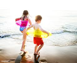 For the smaller set, a beach ball and a towel are great substitutes. Download Premium Image Of Kids Playing At The Beach 424516 Kids Playing Beach Kids Kids Swimming