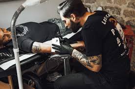 'love' tattoo on her right ear. 10 Best Tattoo Artist In Paris Body Art Guru