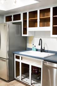 Painting kitchen cabinets brightens a shabby kitchen. How To Paint Kitchen Cabinets Sarah Hearts