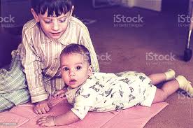 Big Brother With Baby Sister At Home Stock Photo Download Image Now Istock
