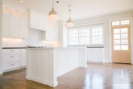 Hicks Island Pendants Transitional Kitchen Tiek Built Homes Home Kitchens Kitchen Island With Cooktop White Shaker Cabinets