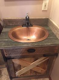 a handmade barnwood vanity from one of