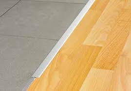 An oxide layer forms on the visible surface of the brass profiles by exposure to air, which causes the surface to darken. Schluter Reno T Profile