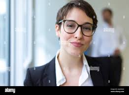 Portait of young business woman in an office with feet up