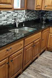 The most popular color is black, which is elegant and timeless. Black Pearl Granite Countertop Multi Color Stone Mosaic Backsplash Light Wood Cabinet Gray Por Kitchen Design Countertops Black Granite Kitchen Granite Kitchen