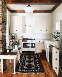 Adorable Farmhouse Kitchen With White Cupboards And Black Rug Sweet Home Home Home Kitchens