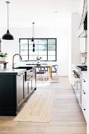 Photo by renaissance design studio the light hardwood floor in this kitchen is the perfect balance to the white counters and the marble on the countertops and backsplash. Pin On Kitchens