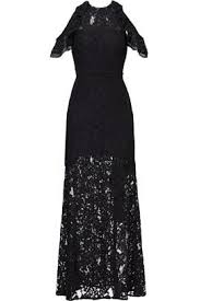 The groom is a classic black tux, the bride is a long sleeve lace wedding dress. Black Tie Dresses