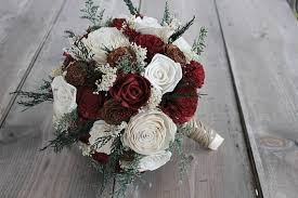 Christmas is right around the corner and if you're celebrating your holiday with a wedding, you may want some floral ideas that pay homage to the season. Winter Wedding Sola Bouquet Cedar Rose Bouquet Burgundy Ivory Sola Flower Bouquet Burgundy Sola Bouquet Christmas Wedding Bouquet Mid South Bride