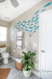 Another novel way of bringing the nautical theme home is the use of authentic ship's hardware. School Of Fish Wall Decor With Free Template H2obungalow