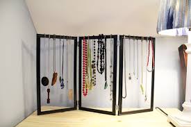 Make a jewelry organizer from a picture frame using these instructions that add cup hooks and chicken wire to the frame for hanging jewelry. Jewelry Organizer Diy Dollar Store Hack Ideas For The Home