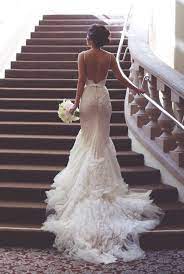 Backless floral lace wedding dresses with mermaid train. Nawara Ghanem Nabadspirit Profile Pinterest