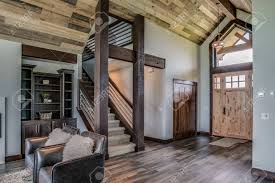 Barnwood ceiling treatments can flow throughout the home. Grand Entrance To This Showcase Home With Barn Wood Beams And Stock Photo Picture And Royalty Free Image Image 146682507
