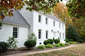 White and black painted brick house. Painting Our Brick House White Young House Love