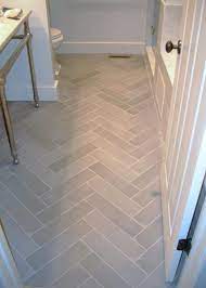 The sculpt white tiles redefine the terra cotta look as a modern and minimalist design. Gray Herringbone Tile Gray Herringbone Tile Flooring Bathroom Flooring