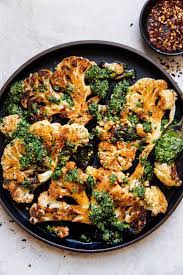 Cauliflower Steak With Walnut Kale Pesto The Modern Proper Recipe Vegetarian Thanksgiving Recipes Vegetarian Thanksgiving Vegetarian Recipes Hearty