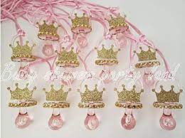 We offer perfectly matching, themed baby shower supplies and baby shower decorations, novelty baby shower favors to complement the theme, and plenty of keepsakes, balloons, and candy favors to celebrate any sort of baby shower, traditional or otherwise. Amazon Com 12 Princesa Chupete Corona Oro Collar Baby Shower Favor Juego Es Una Nina Decoracion Recuerdos De Baby Shower Health Personal Care