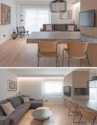 A Cantilevered Dining Table Separates The Kitchen And Living Room In This Apartment Separate Kitchen And Living Room Living Room House Interior