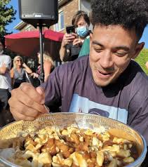 Say cheese! Lightning forward Mathieu Joseph eats poutine out of Stanley  Cup