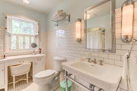 Our reinvented early 1940's bathroom included walling up the doorway to the laundry room, lots of framing, braking through the opposite wall this is probably one of my favorite things in the bathroom: 1940 S Farmhouse In The City Farmhouse Bathroom Columbus Houzz