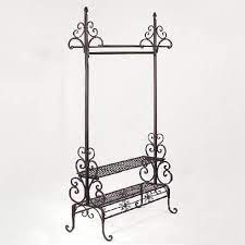 Clothing racks by material clothing racks come in a variety of materials, including steel, wood, plastic and aluminum. Scrolled Metal Clothing Rack 2 Shelves Coat Rack Display