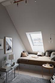A Bedroom With Slanted Ceiling