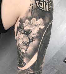 Blossom Cherry Flowers Tattoo Black And Grey Art Work On Arm As A Part Of A Beautiful Realistic Sleeve By Cherry Blossom Tattoo Tattoos Black And Grey Tattoos