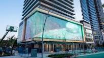 Outdoor LED Mesh Display Transforms Building into North America’s Largest  Digital Art Canvas