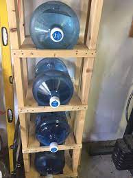 The carrying handle makes it a great portable water container. 5 Gallon Water Jug Storage Shelf Water Bottle Storage Rack Water Bottle Storage Gallon Water Jug