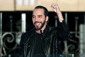 El salvador's president nayib bukele, accompanied by his wife gabriela de bukele, shows his finger after casting his vote during the municipal and parliamentary elections in san. The Significance Of Nayib Bukele S Surprising Election As President Of El Salvador