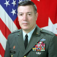Col. Nathan Green stands after being appointed commander