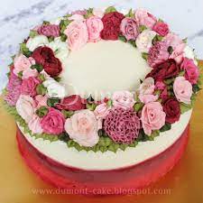 A Remake From One Of Our Previous Collection Rose Carnation Ranunculus And Peony Flower Wreath In Pink Pur Flower Cake Buttercream Flowers Buttercream Cake