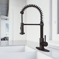 Elegant black kitchen sink with silver faucet in stylish kitchen interior with wooden walls. Vigo Edison Matte Black 1 Handle Deck Mount Pull Down Handle Kitchen Faucet Deck Plate Included In The Kitchen Faucets Department At Lowes Com