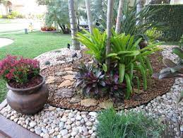 Wonderful rock decoration for your yard. As Mentioned Before Tropical Areas Have A Tendency To Be A Bit More Complicated When It Com Rock Garden Design Front Yard Landscaping Design River Rock Garden