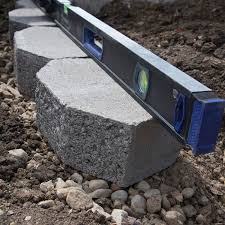It's important to note that, when placing the blocks, do not slide them on your base sand. How To Build A Block Retaining Wall