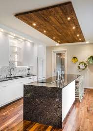 Kitchen ceiling ideas became one of the essential things to decor. Contemporary White Kitchen With Wood Panel Ceiling Accent Kitchen Ceiling Design House Ceiling Design Kitchen Lighting Design