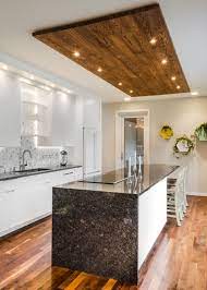 Foodie and chef kelsey of the blog little bits of feels this joy every time she steps into her kitchen, with its high ceilings, generous counter space, and large farmhouse. Contemporary White Kitchen With Wood Panel Ceiling Accent Kitchen Ceiling Design House Ceiling Design Kitchen Lighting Design